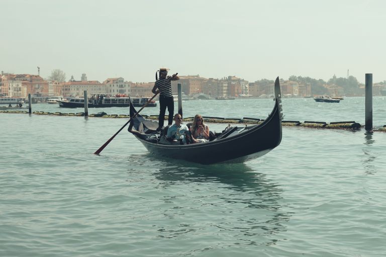 A serene gondola ride on Venice's iconic canals captures the essence of Italian romance.