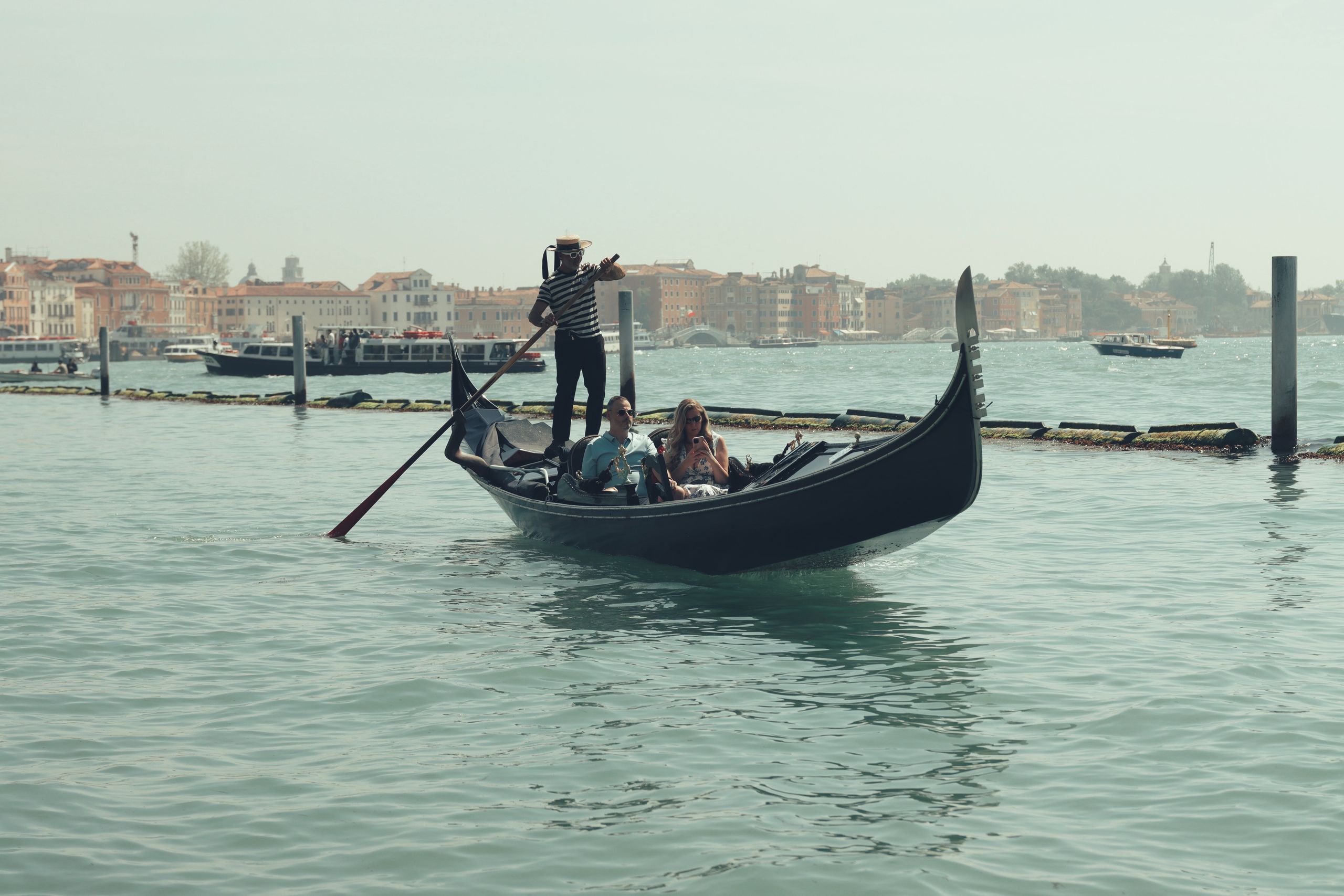 A serene gondola ride on Venice's iconic canals captures the essence of Italian romance.